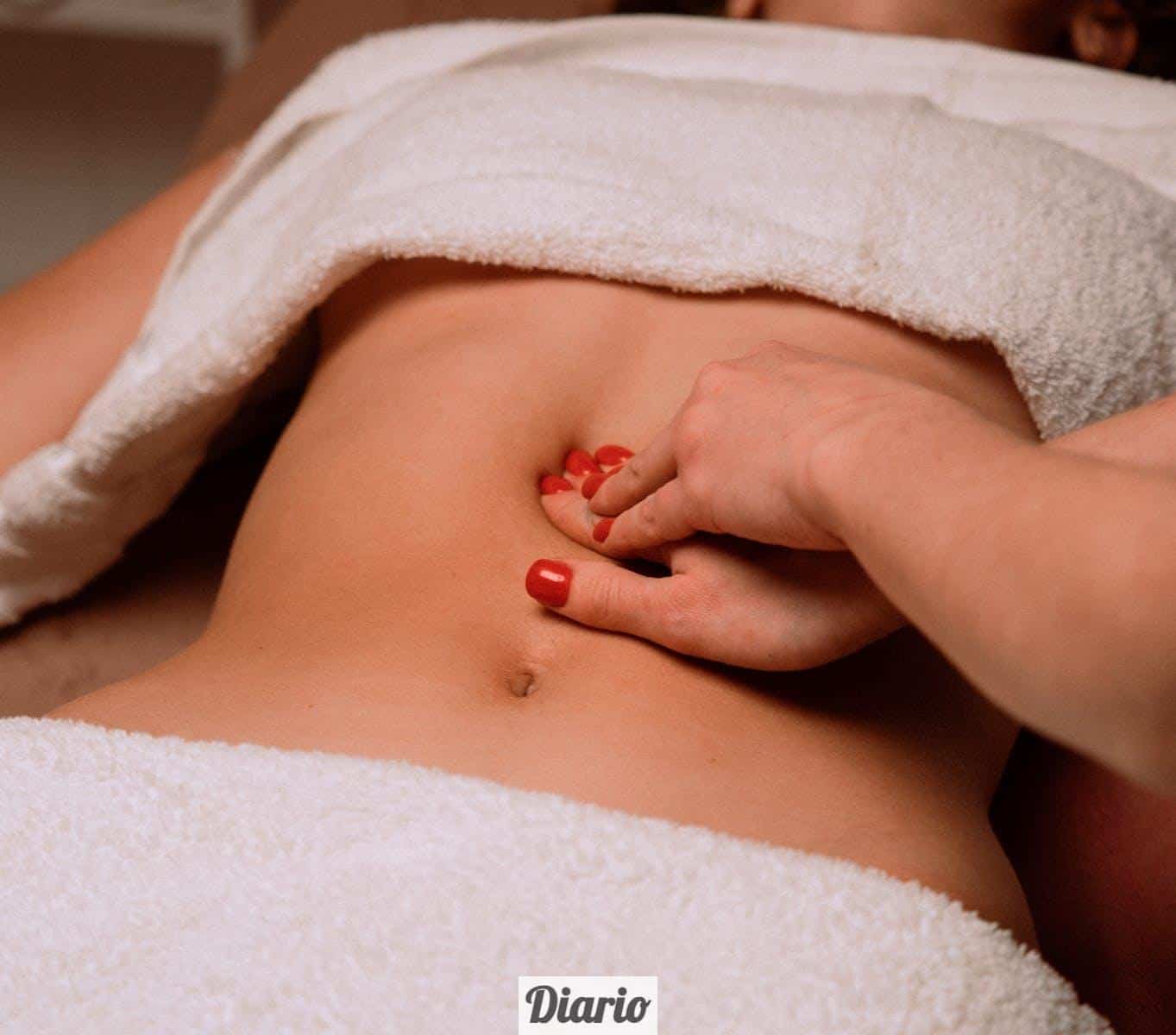 Masseur Giving Woman Stomach Massage