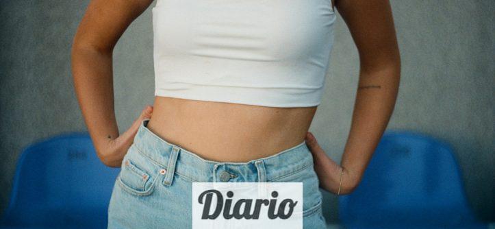 woman in white tank top and blue denim jeans
