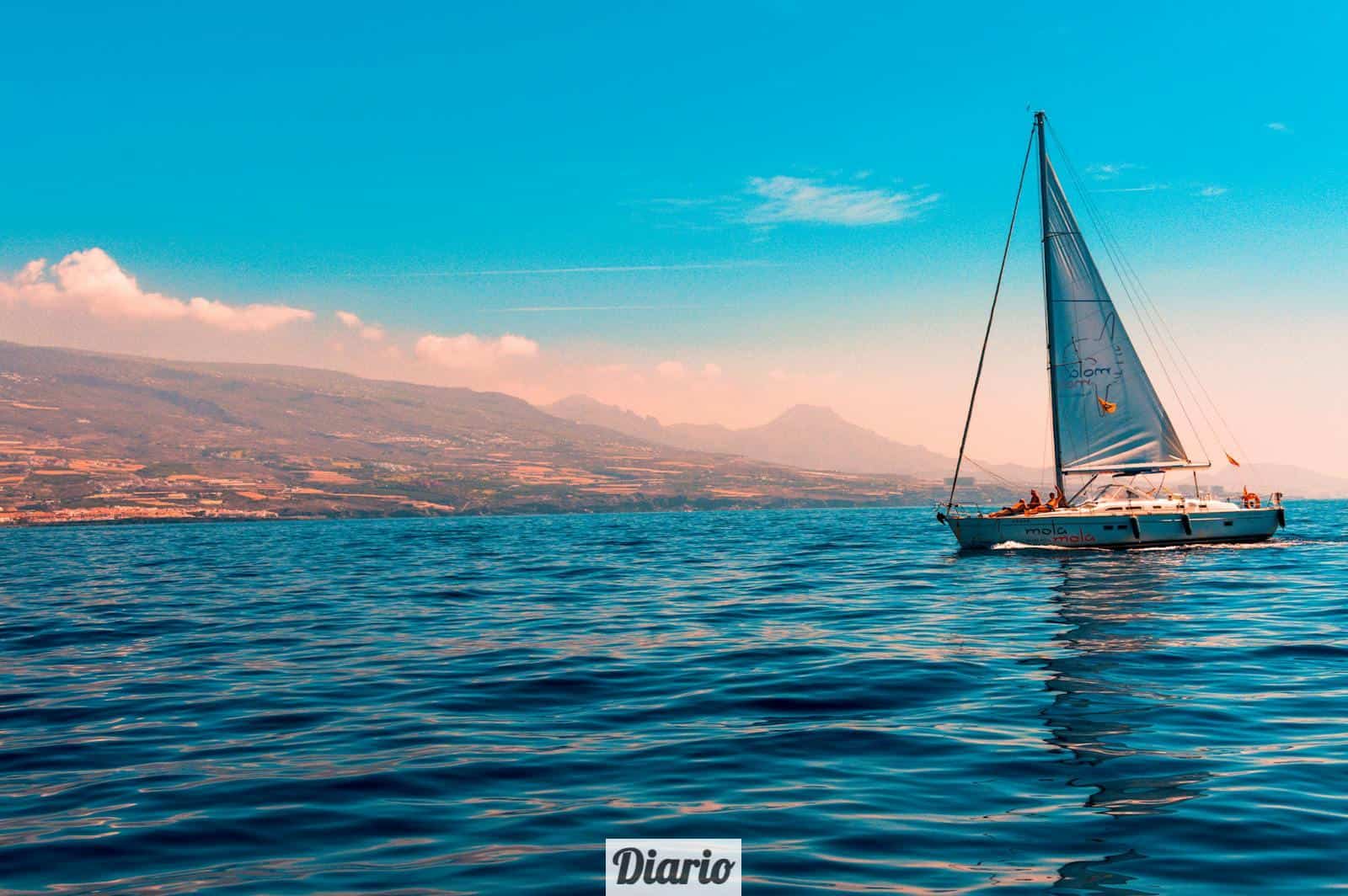 Sailboat Sailing on Water Near Island