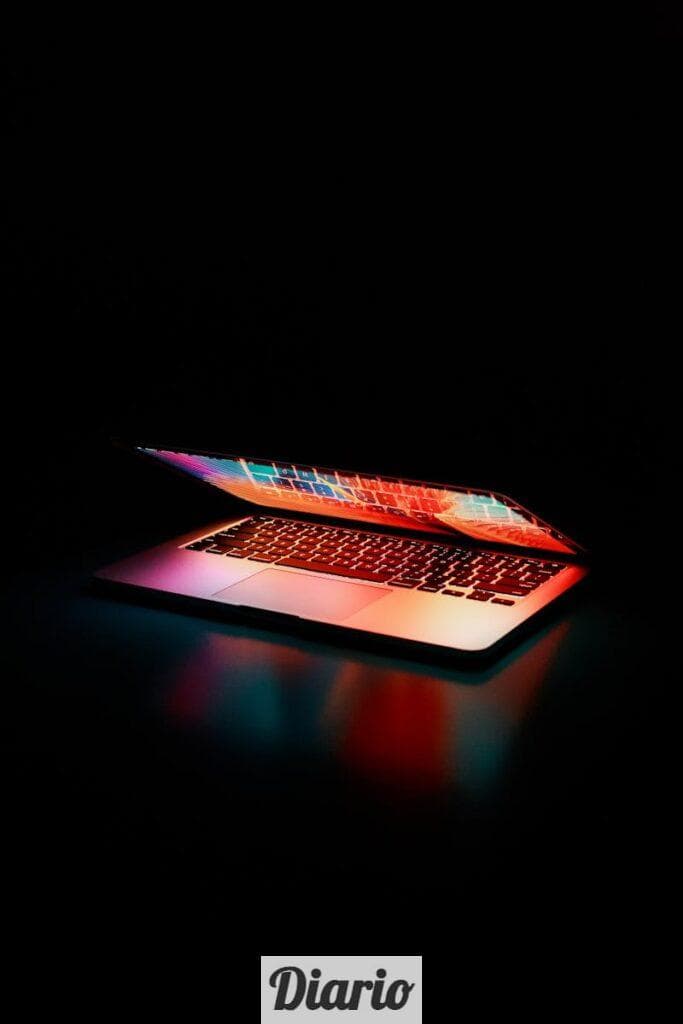 Semi-opened Laptop Computer Turned-on on Table