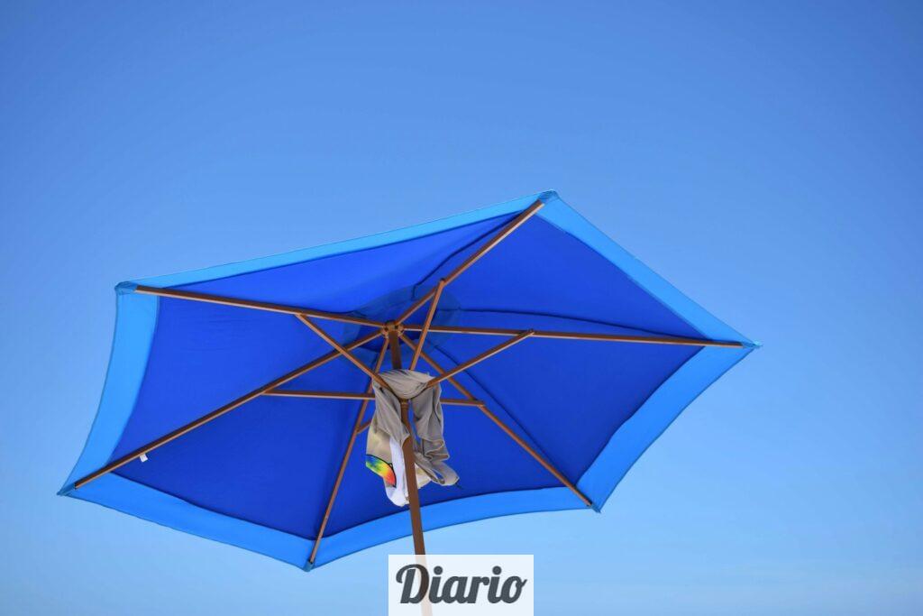 blue and brown patio umbrella during daytime