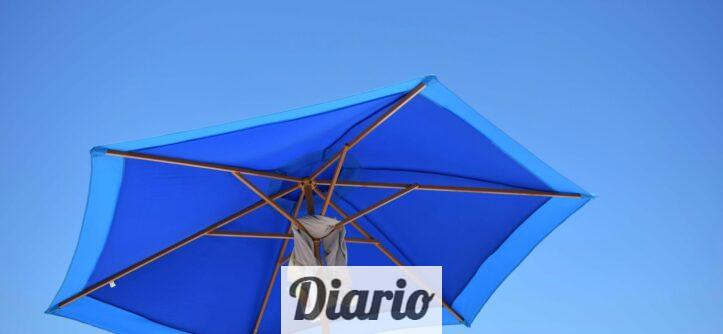 blue and brown patio umbrella during daytime