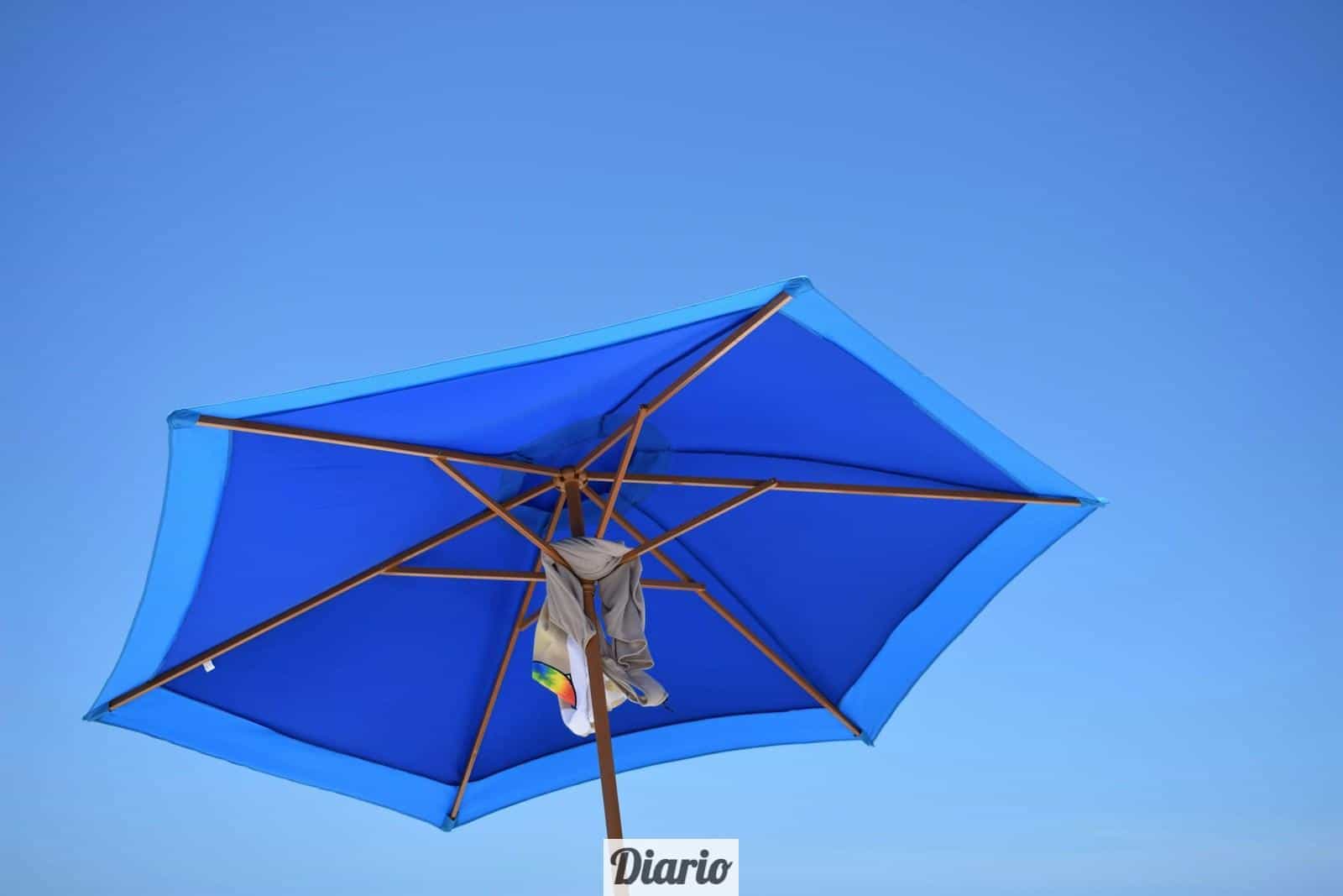 blue and brown patio umbrella during daytime